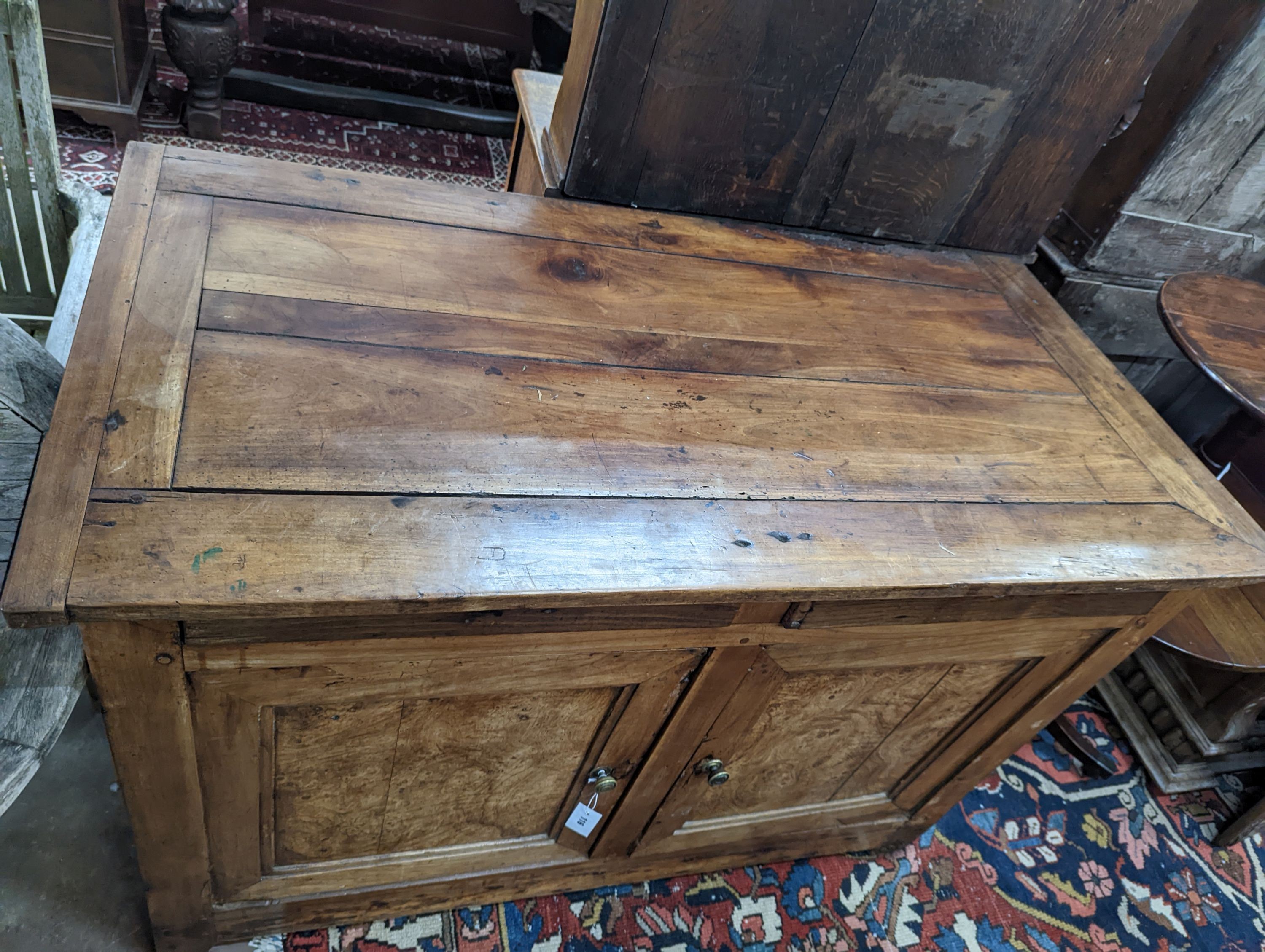 A late 18th / early 19th century French walnut and fruitwood side cabinet, width 130cm, depth 65cm, height 92cm